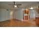 View of the open floor plan featuring laminate floors that connects to the kitchen and hallway at 916 Great Bend Rd, Altamonte Springs, FL 32714