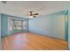 Spacious bedroom featuring hardwood floors, ceiling fan, and bright windows at 925 S Dean Cir, Deltona, FL 32738