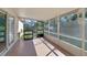 Screened patio overlooking backyard, featuring tiled flooring and an open view at 925 S Dean Cir, Deltona, FL 32738