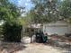 Residential home showcasing overgrown foliage and a two-car garage at 9325 Echo Run, Orlando, FL 32817