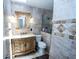 Bathroom featuring marble tile, modern toilet and glass shower enclosure at 5723 Harcourt Ave, Orlando, FL 32810