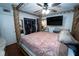 Bedroom with four-poster bed, ceiling fan and walk in closet at 5723 Harcourt Ave, Orlando, FL 32810