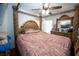 Bedroom with four-poster bed, ceiling fan, and traditional furnishings at 5723 Harcourt Ave, Orlando, FL 32810