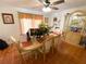 Bright dining room with tile flooring, a window and a table set for six, perfect for Gathering meals at 5723 Harcourt Ave, Orlando, FL 32810