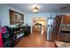 The spacious kitchen showcases stainless steel appliances, and access to the dining room at 5723 Harcourt Ave, Orlando, FL 32810