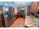 The eat-in kitchen features stainless steel appliances and ample counter space at 5723 Harcourt Ave, Orlando, FL 32810