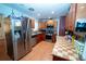 This well-lit kitchen is equipped with modern appliances and stylish cabinets at 5723 Harcourt Ave, Orlando, FL 32810