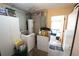 The laundry room includes a washer, dryer, water heater, and plenty of storage space at 5723 Harcourt Ave, Orlando, FL 32810