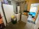 This laundry room features a washing machine, dryer, and storage cabinets at 5723 Harcourt Ave, Orlando, FL 32810