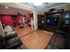 A view of the living room featuring tile floors and a dark entertainment center at 5723 Harcourt Ave, Orlando, FL 32810