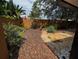 Backyard featuring a stone walkway and landscaping at 104 Oaks Ct, Sanford, FL 32771