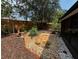 A well-landscaped backyard featuring mature trees, decorative rocks, and a private setting at 104 Oaks Ct, Sanford, FL 32771