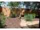 Landscaped backyard showcasing decorative gravel, mulch, and plants, offering a private outdoor retreat at 104 Oaks Ct, Sanford, FL 32771