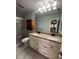 Bright bathroom with double sinks, and walk-in shower at 104 Oaks Ct, Sanford, FL 32771