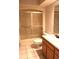 This bathroom is equipped with a shower, toilet, sink and wood-finished vanity at 104 Oaks Ct, Sanford, FL 32771