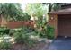 Exterior view of home with well-maintained landscaping, driveway, and attached garage at 104 Oaks Ct, Sanford, FL 32771