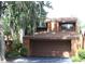 Inviting two story home with an attached garage, nestled under trees, and well-manicured landscaping at 104 Oaks Ct, Sanford, FL 32771