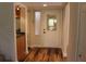 Home foyer featuring beautiful flooring and a leaded glass window in the front door at 104 Oaks Ct, Sanford, FL 32771