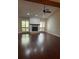 Bright living room with a fireplace, ceiling fan and large windows at 104 Oaks Ct, Sanford, FL 32771