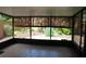 Enclosed patio features tiled floors with serene views of the landscaped garden at 104 Oaks Ct, Sanford, FL 32771