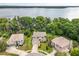 Aerial view of several homes with a lake view in the distance at 1203 Stone Harbour Rd, Winter Springs, FL 32708