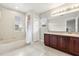 Bright bathroom featuring a tub, shower, and large vanity with ample storage at 1203 Stone Harbour Rd, Winter Springs, FL 32708