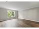 Bedroom features hardwood floors and a window with natural light at 1203 Stone Harbour Rd, Winter Springs, FL 32708