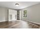 Bedroom with hardwood floors, and built-in shelves/cabinets with a window view at 1203 Stone Harbour Rd, Winter Springs, FL 32708