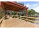 Wooden dock with covered area and a wooden railing overlooking the lake at 1203 Stone Harbour Rd, Winter Springs, FL 32708