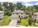 Two-story home with a two-car garage, neutral exterior, and manicured landscaping at 1203 Stone Harbour Rd, Winter Springs, FL 32708