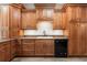 Kitchen features wood cabinets, granite countertops, and stainless steel appliances at 1203 Stone Harbour Rd, Winter Springs, FL 32708