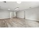 Open-concept living room with modern flooring and recessed lighting at 1203 Stone Harbour Rd, Winter Springs, FL 32708
