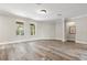 Spacious living room featuring neutral colors, vinyl wood flooring, and ample natural light at 1203 Stone Harbour Rd, Winter Springs, FL 32708