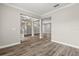 Open-concept living area with wood-look floors and modern architectural details at 1203 Stone Harbour Rd, Winter Springs, FL 32708