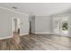Open floorplan living room with hardwood flooring, double doors and neutral paint at 1203 Stone Harbour Rd, Winter Springs, FL 32708