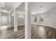 Spacious living room featuring light gray walls, hardwood flooring and white trim at 1203 Stone Harbour Rd, Winter Springs, FL 32708