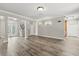Open-concept living room showcasing beautiful hardwood floors, neutral walls, and ample natural light at 1203 Stone Harbour Rd, Winter Springs, FL 32708