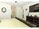 The bedroom offers a ceiling fan, TV, closet, and leads to an en suite bathroom at 1313 Middle Lake Dr, Ormond Beach, FL 32174