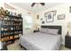 Bedroom decorated with sports memorabilia, a ceiling fan, and a comfortable-looking bed at 1313 Middle Lake Dr, Ormond Beach, FL 32174