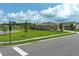 Charming single-Gathering home with a well-kept lawn, situated on a corner lot with inviting landscaping, under a blue sky at 1313 Middle Lake Dr, Ormond Beach, FL 32174