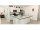 Modern kitchen with granite countertops, stainless steel appliances, and a center island for easy meal prep at 1313 Middle Lake Dr, Ormond Beach, FL 32174