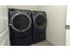 Modern laundry room showcasing a GE washer and dryer set with stylish design at 1313 Middle Lake Dr, Ormond Beach, FL 32174