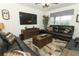 Comfortable living room with ample seating, a large TV, and lots of natural light creating an inviting space at 1313 Middle Lake Dr, Ormond Beach, FL 32174
