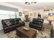 Open-concept living room with sleek furniture flowing into the kitchen and dining area for easy living at 1313 Middle Lake Dr, Ormond Beach, FL 32174
