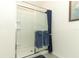 Bright shower with sliding glass door and blue towels at 1313 Middle Lake Dr, Ormond Beach, FL 32174