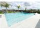 Backyard pool with elegant white tile and decorative fountains surrounded by seating at 1313 Middle Lake Dr, Ormond Beach, FL 32174