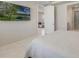 Bright bedroom featuring a flat screen television and a doorway to the living room at 13562 Pearl Beach St, Winter Garden, FL 34787