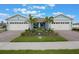 Charming home exterior with two car garages, lush landscaping and brick paver driveway at 13562 Pearl Beach St, Winter Garden, FL 34787