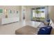 Bright living room with marble floors, a comfortable couch, and sliding door leading to the backyard at 13562 Pearl Beach St, Winter Garden, FL 34787