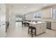 Spacious open-concept living space with eat-in kitchen, dining area, and sliding glass doors to the backyard at 13562 Pearl Beach St, Winter Garden, FL 34787
